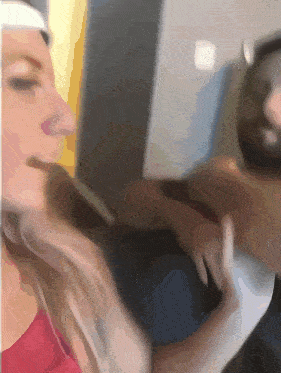 a blurry picture of a man and a woman looking at each other
