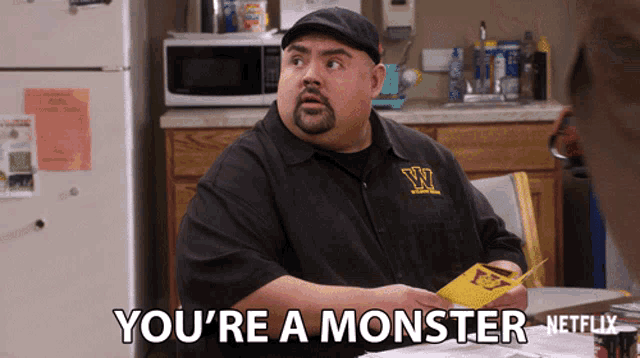 a man in a black shirt with a w on it says you 're a monster