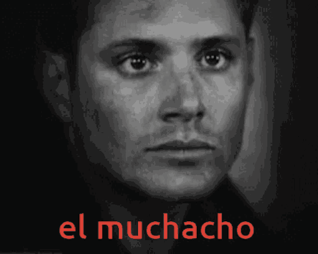 a close up of a man 's face with the words el muchacho in red