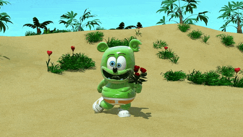 a green gummy bear holding a bunch of flowers