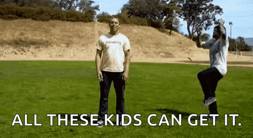two men are standing in a grassy field with the words all these kids can get it