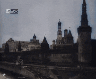 a black and white photo of a city with 24 ack written on the bottom right