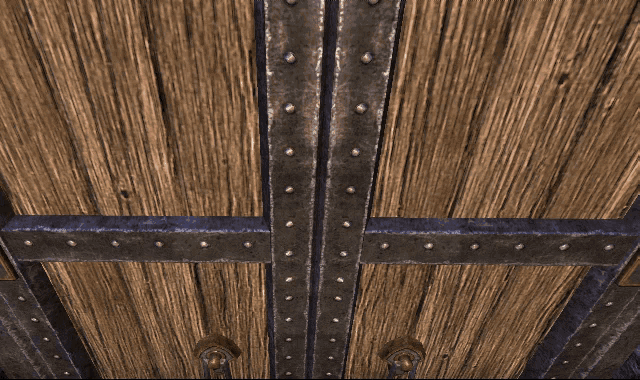 a person 's hand is reaching for a wooden door in a video game