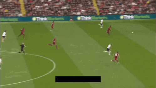 a soccer player with the number 1 on his shirt is running towards the ball