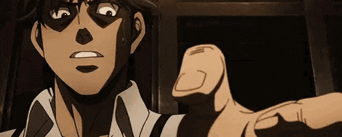 a close up of a cartoon character pointing at the camera with his finger .