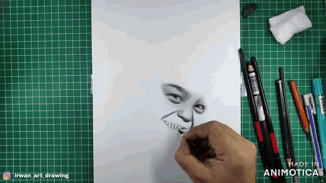 a drawing of a man 's face is on a green cutting board