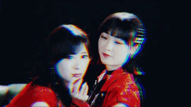 a girl in a red jacket is looking at the camera with a glitch effect .