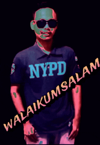 a man wearing sunglasses and a nypd shirt stands in a dark room