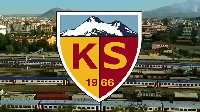 a red and yellow shield with the letters ks 1966 on it