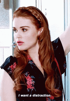 a woman with red hair is wearing a floral shirt and says i want a distraction .