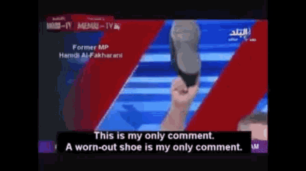 a man holds a shoe in his hand and says this is my only comment a worn out shoe is my only comment