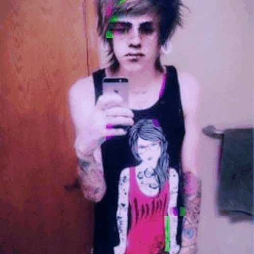 a person taking a picture of themselves with their phone