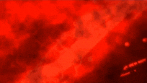 a close up of a red and black background with a swirling pattern