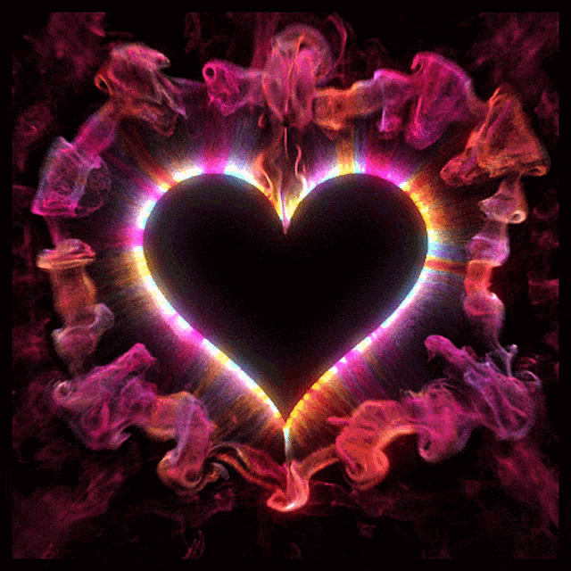 a black heart is surrounded by colorful smoke and light