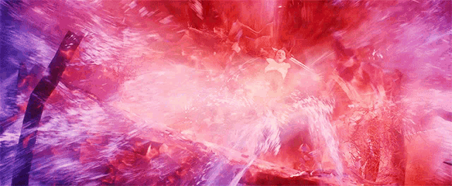a person is being thrown into a purple and red explosion .