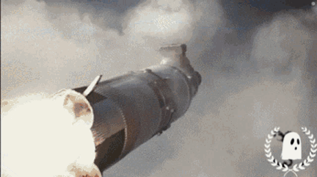 a rocket is flying through the air with a laurel wreath and a ghost in the background