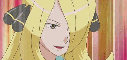 a woman is holding a pokeball in her hand .