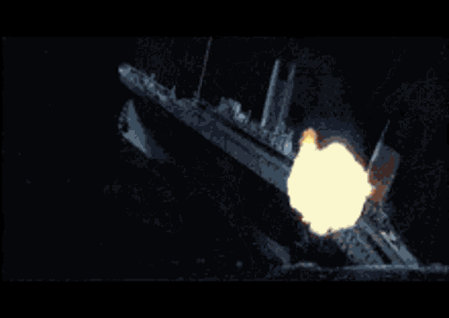 a large fireball is coming out of a ship