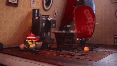 a minion in a fireman 's hat is standing in a room with a red chair .