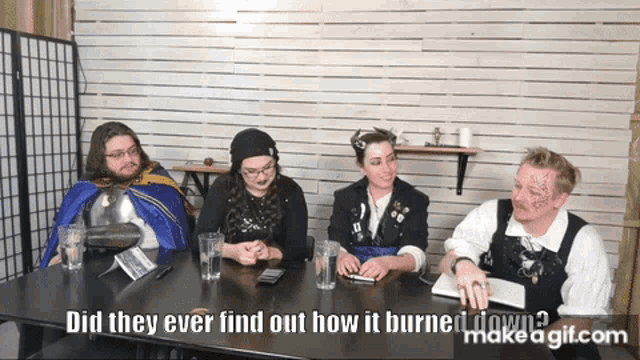 a group of people sitting at a table with the words " did they ever find out how it burned down "