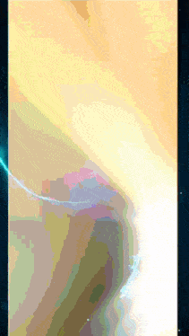 a computer screen shows a rainbow of colors and a blue light coming out of it
