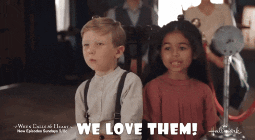 a boy and a girl are sitting next to each other with the words " we love them " above them