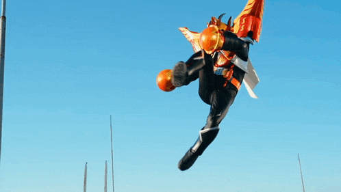 a person in a robot costume is jumping in the air .