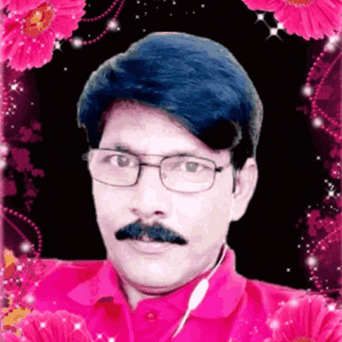a man with glasses and a mustache in a pink shirt is surrounded by pink flowers