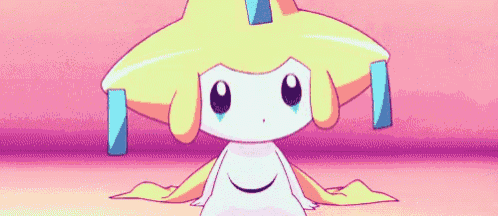 a cartoon character with a yellow hat is sitting on a pink surface and crying .