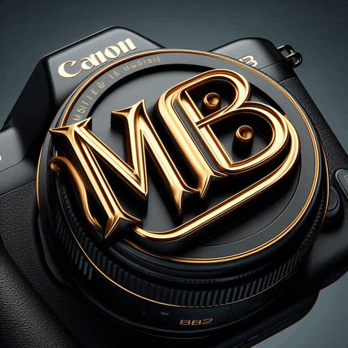 a black canon camera with a gold mb logo on the lens