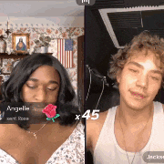 a man and a woman are sitting next to each other in a living room .