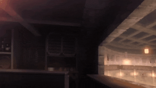 a dark room with a ceiling that has a grid pattern on it