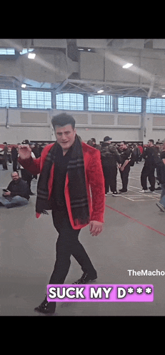 a man in a red jacket and black scarf says suck my d * * * *
