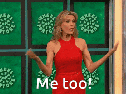 a woman in a red dress is standing in front of a wheel of fortune sign .