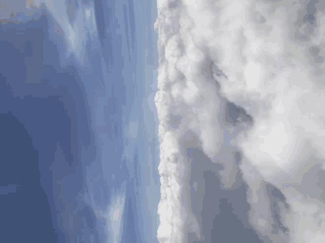 a blue sky with a few clouds floating in it