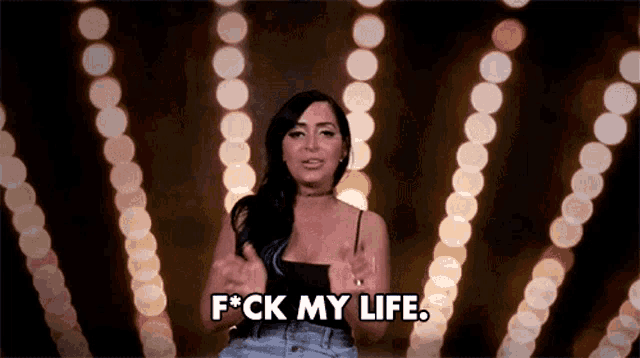 a woman is giving a thumbs up while saying f * ck my life