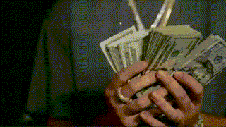 a person is holding a stack of money in their hands