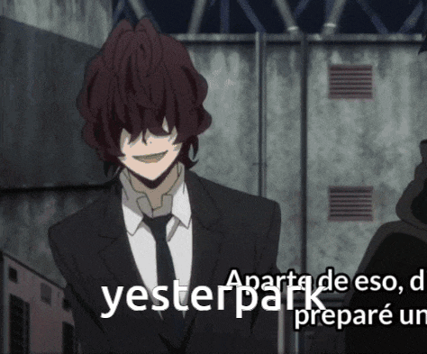 a man in a suit and tie stands in front of a sign that says " yesterday "
