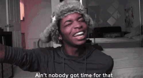 a man wearing a fur hat is laughing with the words ain 't nobody got time for that below him