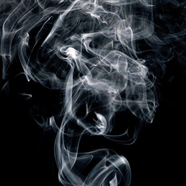 a black background with white smoke coming out of the corner