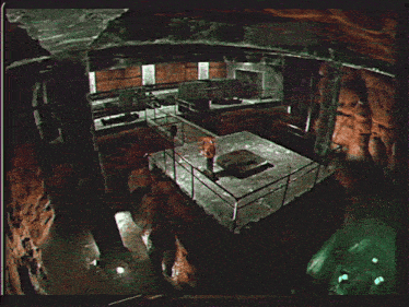 a dark room with a person standing on a balcony