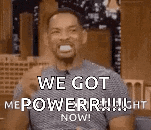 a man is making a funny face and saying `` we got me power ! ''