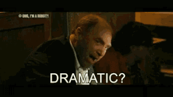 a man in a suit and tie is asking the question " dramatic "