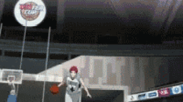 a basketball player is jumping in the air while holding a basketball in front of a basketball hoop .