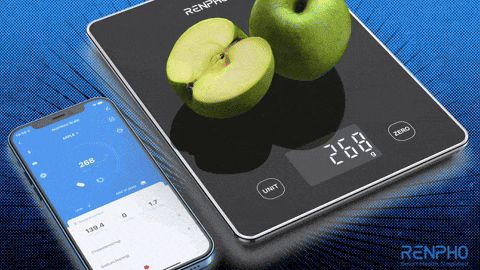 a renpho scale with a green apple on top
