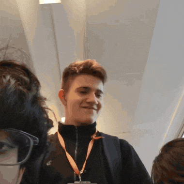 a young man wearing a lanyard with a nike logo