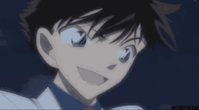 a close up of a boy 's face with a blue background and the words mysteryheolie on the bottom right