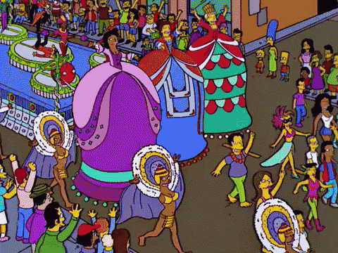 a crowd of people are watching a carnival parade with cartoon characters