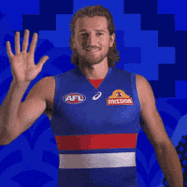 a man wearing a blue shirt with afl written on it