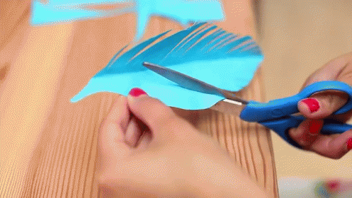 Feather Gift Wrap GIF - Feather Paper Art Present GIFs